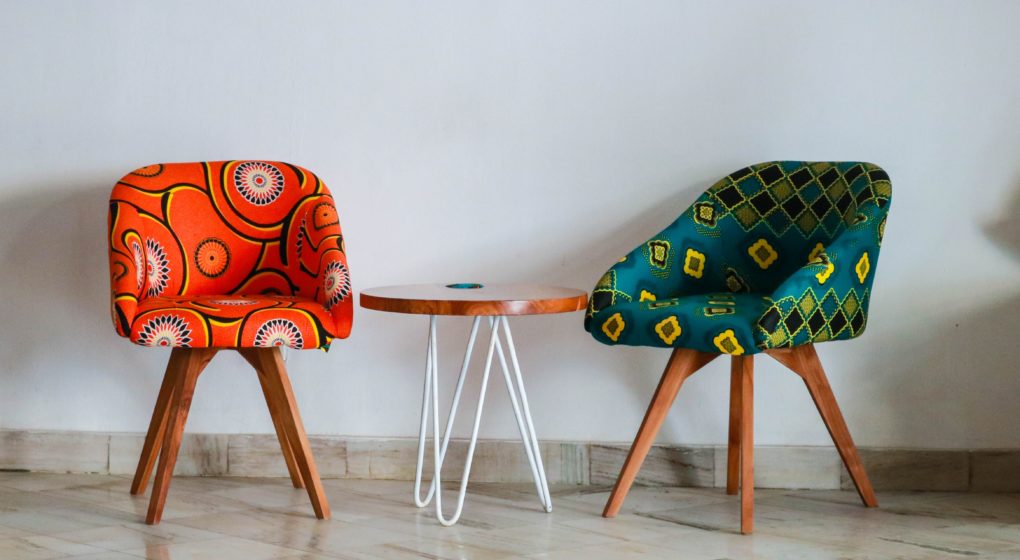two-assorted-color-padded-chairs-near-side-table-1350789